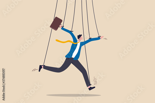 Business management, people manipulation or power to dominate actions concept, fake businessman pretending to be smart with rope or string as puppeteer doll controlled or influence by power boss.
