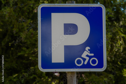 motorcycle parking sign, green background