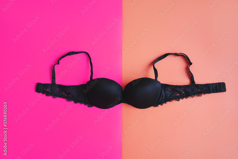 Classic Black bra on pink background. Women's lingerie. Underwear essentials Classic Black bra on pink background. Women's lingerie. Underwear essentials