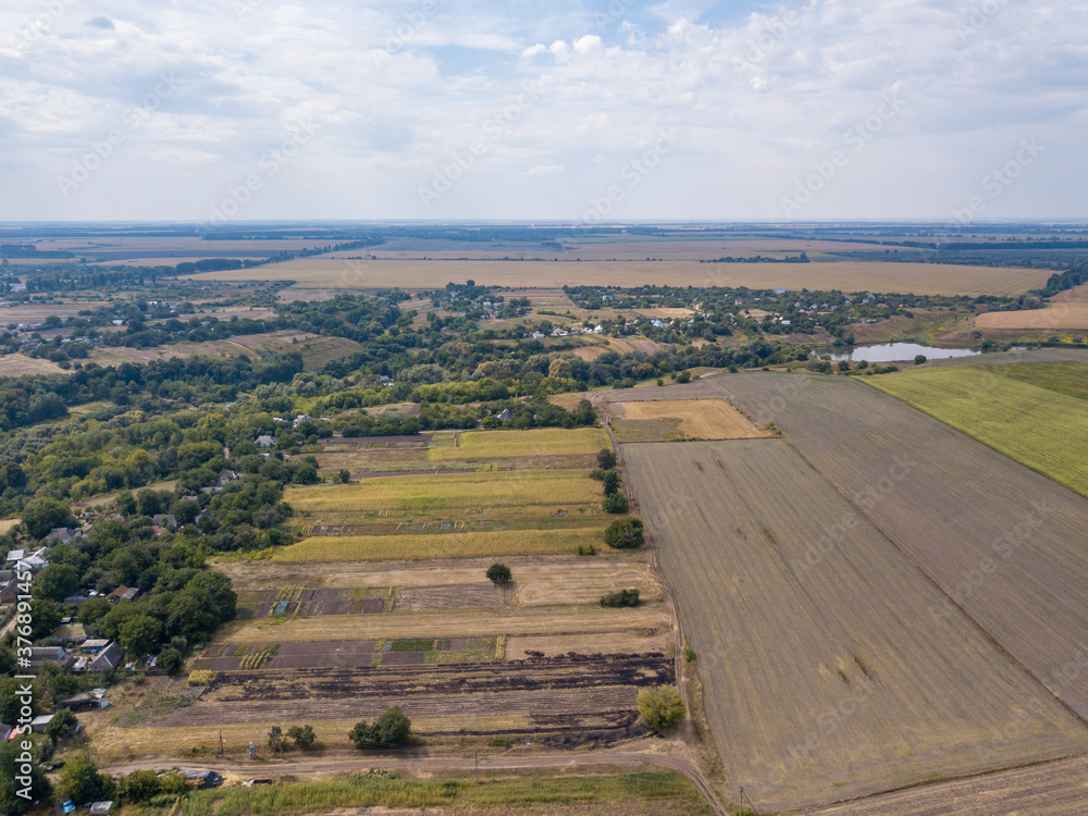 Obraz premium Agricultural village in Ukraine. Aerial drone view.