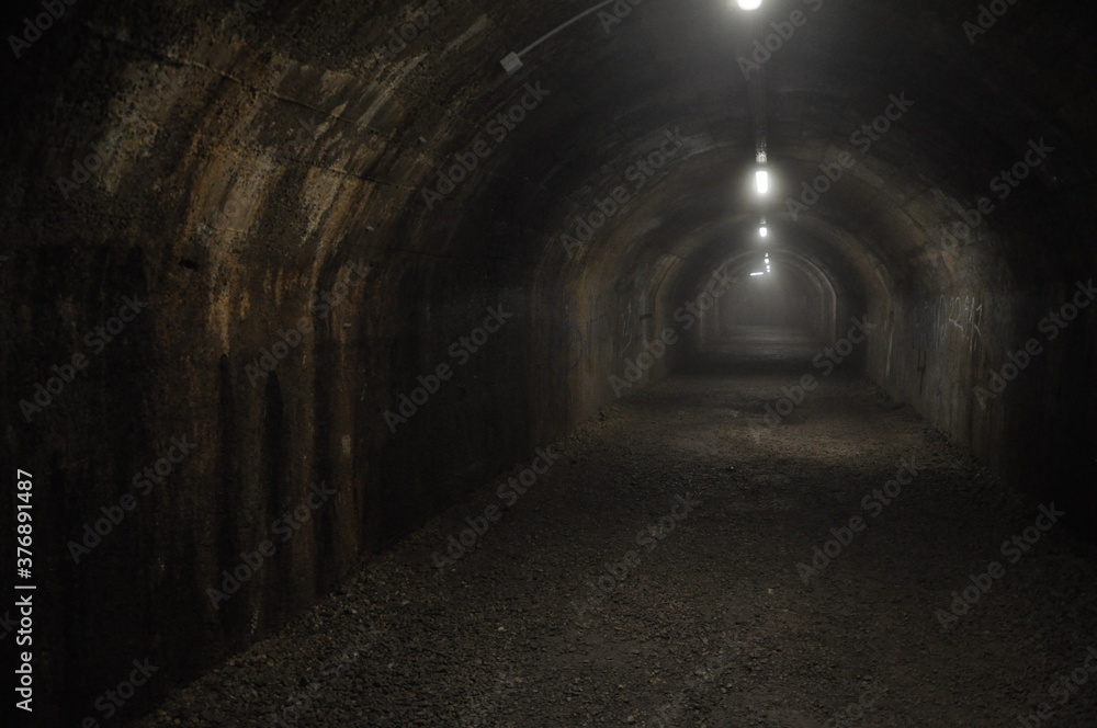 Tunnel of Rijeka built for world war 2. It used to be military object, but now it is tourist attraction of the city. February 2020.Underground dark tunnel made by italian army during World War II.