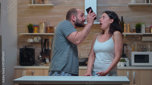 Εκτύπωση καμβά Angry man yelling at unfaithful wife in the kitchen