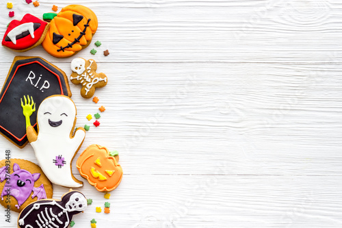 Overhead view of Halloween decorations with cookies and candies, top view