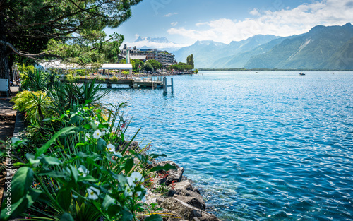 Tela Montreux shoreline with flowers and Lake Geneva view with Alps mountains in back