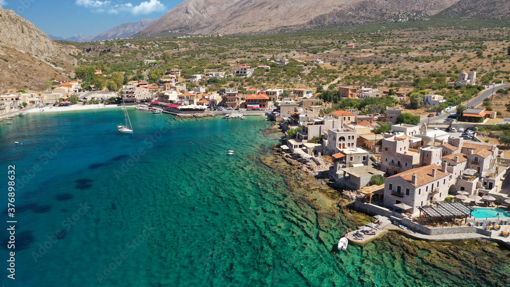 Aerial drone photo of picturesque fishing village of Gerolimenas with crystal clear emerald sea and traditional Lakonian architecture, Mani peninsula, Peloponnese, Greece