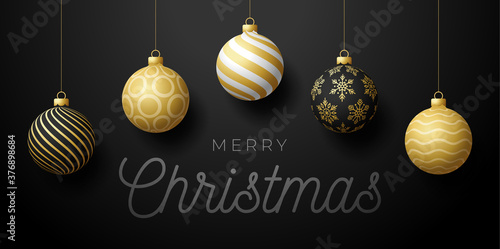 Luxury Christmas horizontal promo banner. Holiday vector illustration with realistic ornate black  white and golden Christmas balls on black background.