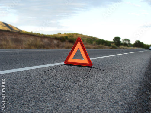 safety triangle in the middle of the road after a car breakdown