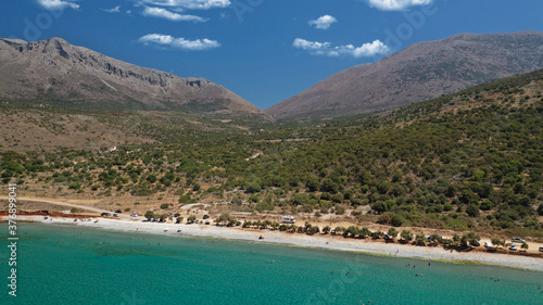 Aerial drone photo of famous turquoise crystal clear emerald bay and beach of Diros well known from beautiful cave, Mani, Peloponnese, Greece