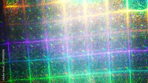 led light moving over interesting grid rainbow holo foil, glitter pattern background loop, nice music video transition or video overlay. holographic surface in 4k.