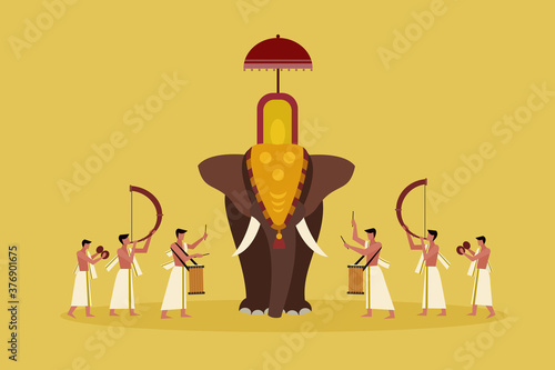 Decorated elephant with people playing percussion instruments.A scene from Kerala's religious festival 