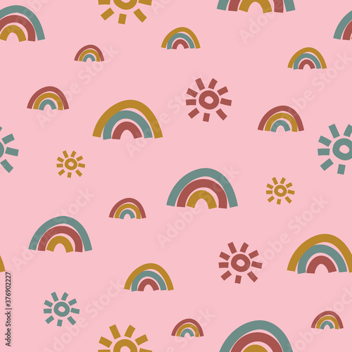 Rainbows and suns seamless vector pattern on pink. Simple chidish surface print design for fabrics, stationery, scrapbook paper, packaging, gift wrap, and packaging.