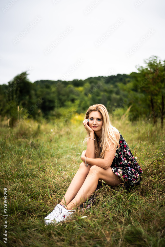 Beautiful young smiling woman outdoors