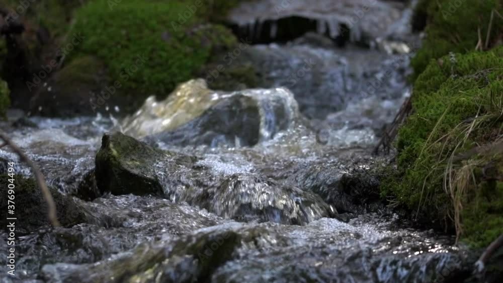 Slowmotion closeup video of small fresh creek flowing beautifully. Tripod shot. Slowmotion closeup video of small fresh creek flowing beautifully. Tripod shot.