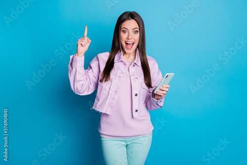 Portrait of her she nice attractive pretty creative cheerful cheery girl using gadget creating new post comment feedback like isolated on bright vivid shine vibrant blue color background