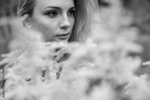 Fototapeta Naklejka Na Ścianę i Meble -  Close-up portrait of a sensual blonde outdoor
