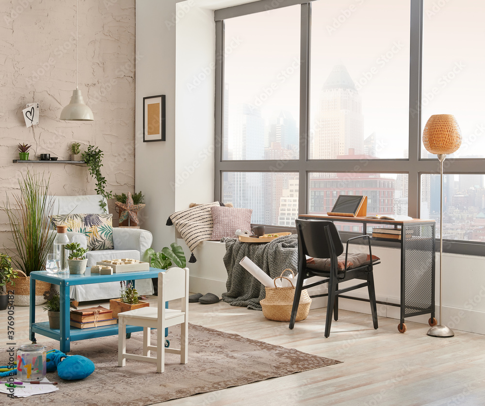 Modern decorative living room corner and city view, child object interior style. Work table and laptop. - obrazy, fototapety, plakaty 
