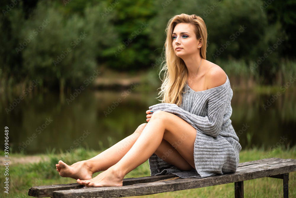 Close-up portrait of beautiful caucasian woman walking outdoors. Beautiful woman in a sweater. Fashion portrait stylish pretty woman outdoor. Close-up portrait of beautiful caucasian woman walking outdoors. Beautiful woman in a sweater. Fashion portrait stylish pretty woman outdoor.