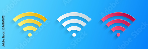 Paper cut Wi-Fi wireless internet network symbol icon isolated on blue background. Paper art style. Vector.