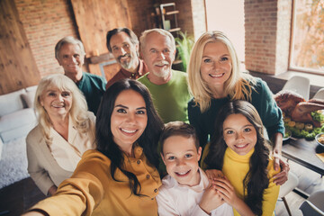 Closeup portrait photo of full family gathering eight people cuddle embrace hold hands finish dinner make shoot selfie memorable lovely picture generation in home evening living room indoors