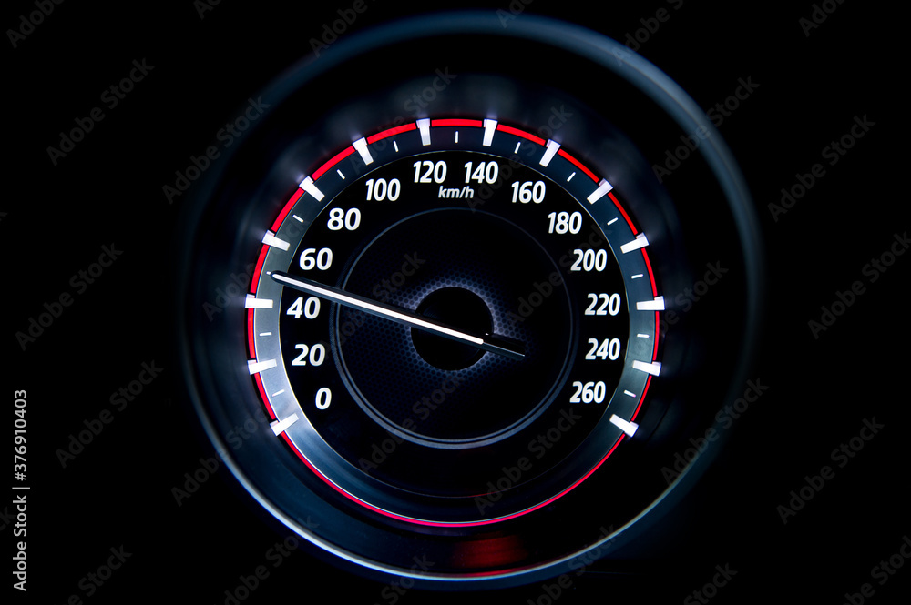 50 Kilometers per hour,light with car mileage with black background,number of speed,Odometer of car.