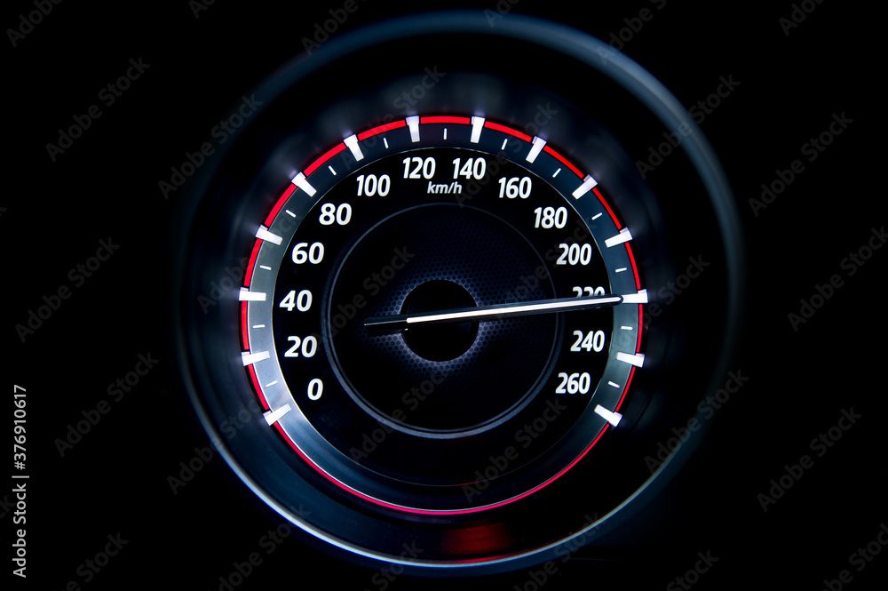 220 Kilometers per hour,light with car mileage with black background,number of speed,Odometer of car.