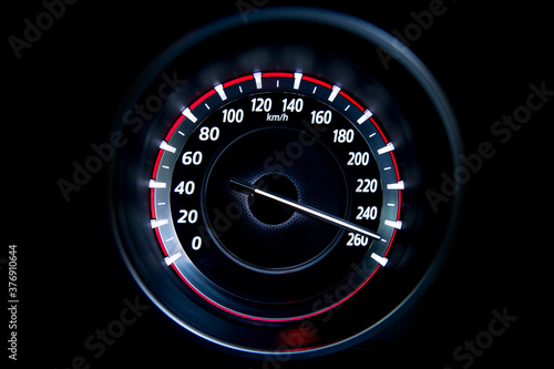 250 Kilometers per hour,light with car mileage with black background,number of speed,Odometer of car. photo