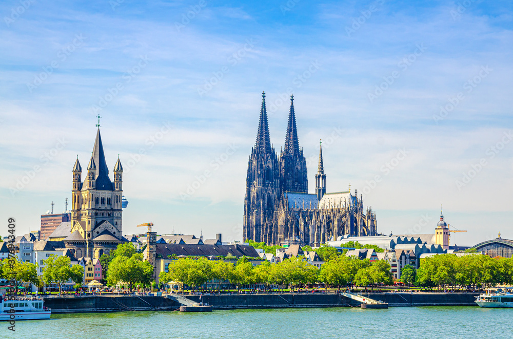 Cologne cityscape of historical city centre with Cologne Cathedral of Saint Peter, Great Saint Martin Roman Catholic Church buildings and embankment of Rhine river, North Rhine-Westphalia, Germany