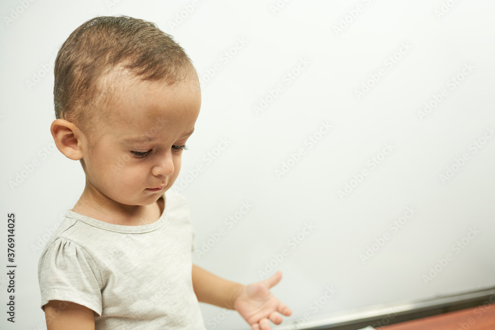 Physical examination of the 1 year old baby boy. Well-baby exam. Regularly scheduled medical check-up, called well-child visits or health checkups Physical examination of the 1 year old baby boy. Well-baby exam. Regularly scheduled medical check-up, called well-child visits or health checkups