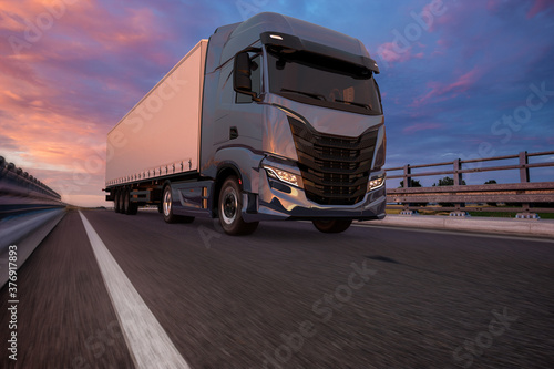 modern truck on the road at sunset