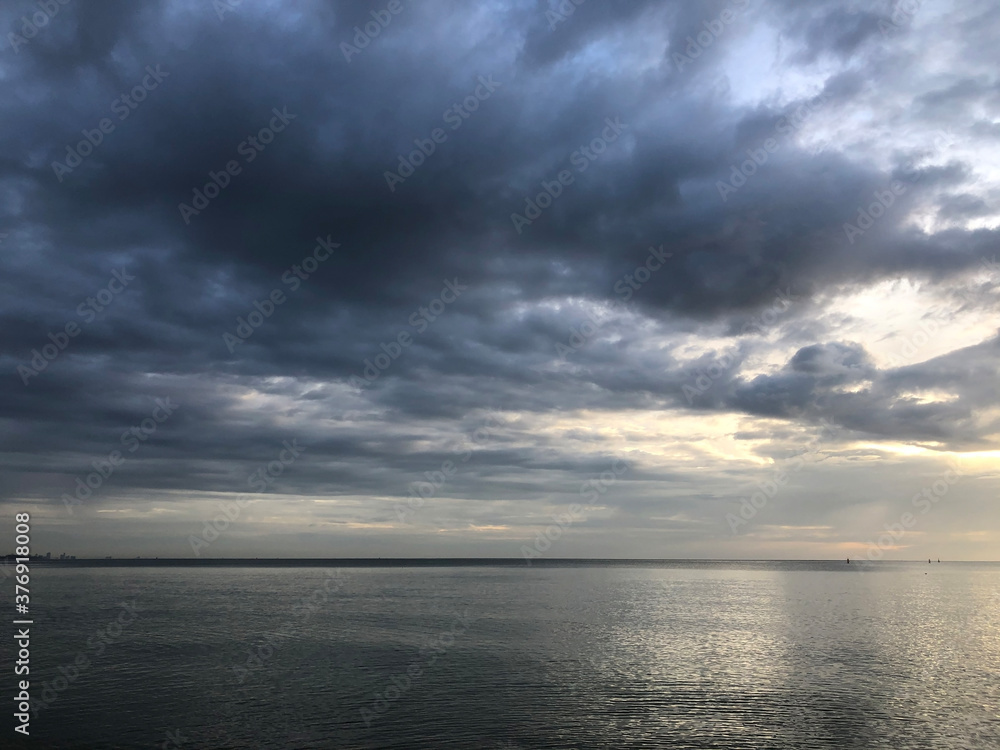 Dark sky and clouds over the ocean before raining and storm background