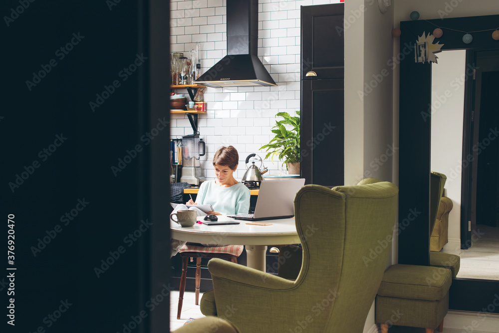 Young beautiful woman working at her home office Young beautiful woman working at her home office