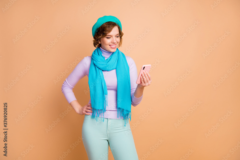 Portrait of her she nice attractive lovely pretty charming cheerful cheery girl using cell browsing internet online 5g media smm isolated over beige pastel color background Portrait of her she nice attractive lovely pretty charming cheerful cheery girl using cell browsing internet online 5g media smm isolated over beige pastel color background