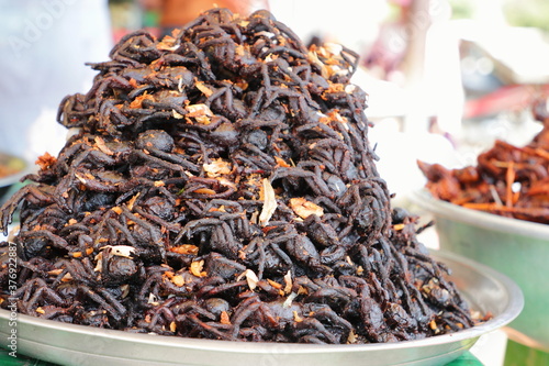 Plate of cooked spiders sold in a Cambogian street market