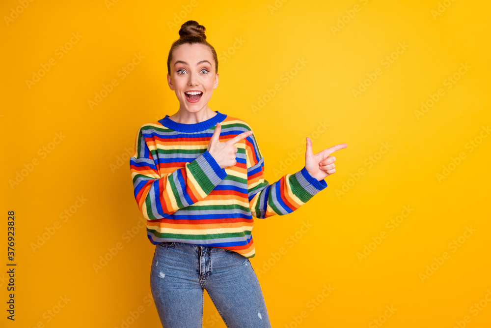 Photo of surprised girl promoter point index finger copyspace impressed advertisement promotion recommend suggest select choice decision wear pullover isolated shine color background Photo of surprised girl promoter point index finger copyspace impressed advertisement promotion recommend suggest select choice decision wear pullover isolated shine color background