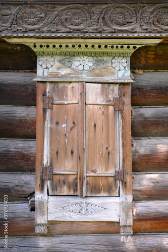 Window of a traditional Russian wooden house of the 19th century. Vyazniki town, Vladimir Oblast, Russia. photo