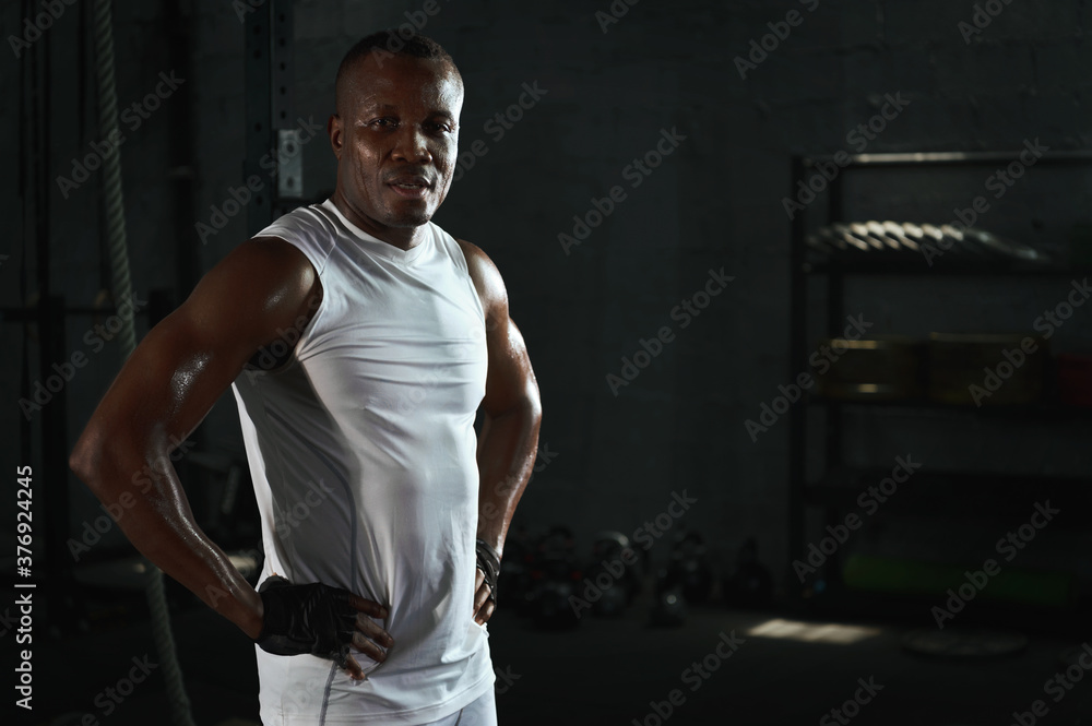 Fit muscular male bodybuilder in gym fitness Fit muscular male bodybuilder in gym fitness
