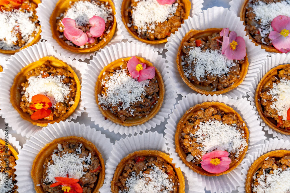 Fruit dessert with nuts on pastry basket. Variety of snacks. View from the top. Closeup. Fruit dessert with nuts on pastry basket. Variety of snacks. View from the top. Closeup.