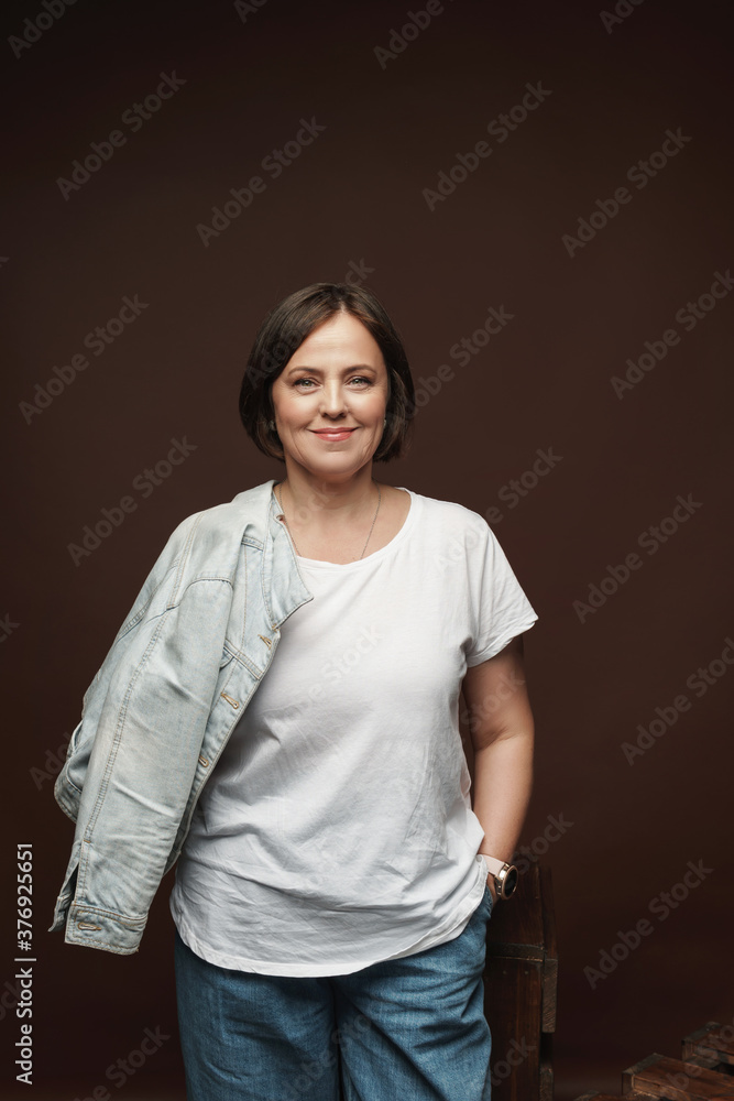 Portrait of a beautiful middle aged woman posing in a studio Portrait of a beautiful middle aged woman posing in a studio