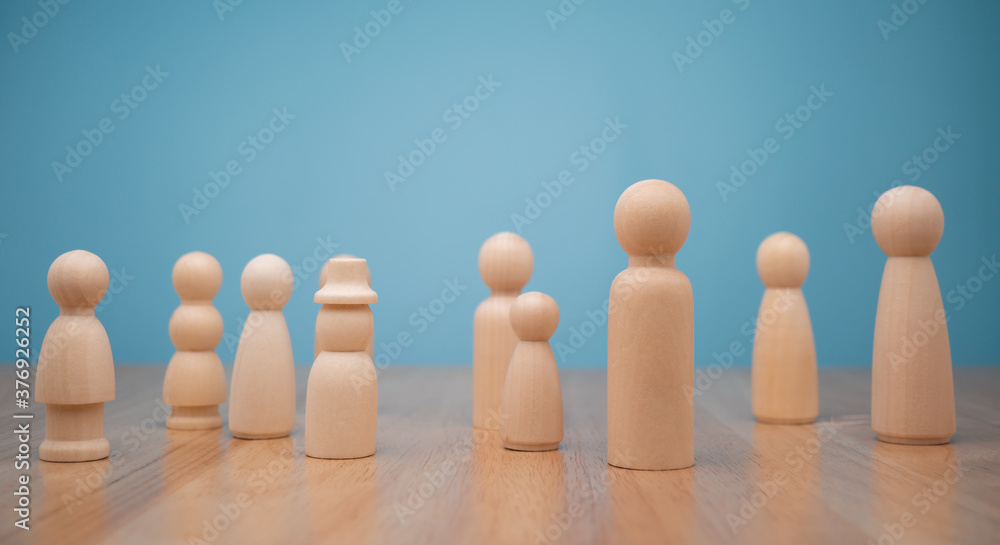 Many wooden human figures, Man and woman standing. Concept of Human resource, Talent management, Recruitment employee Many wooden human figures, Man and woman standing. Concept of Human resource, Talent management, Recruitment employee