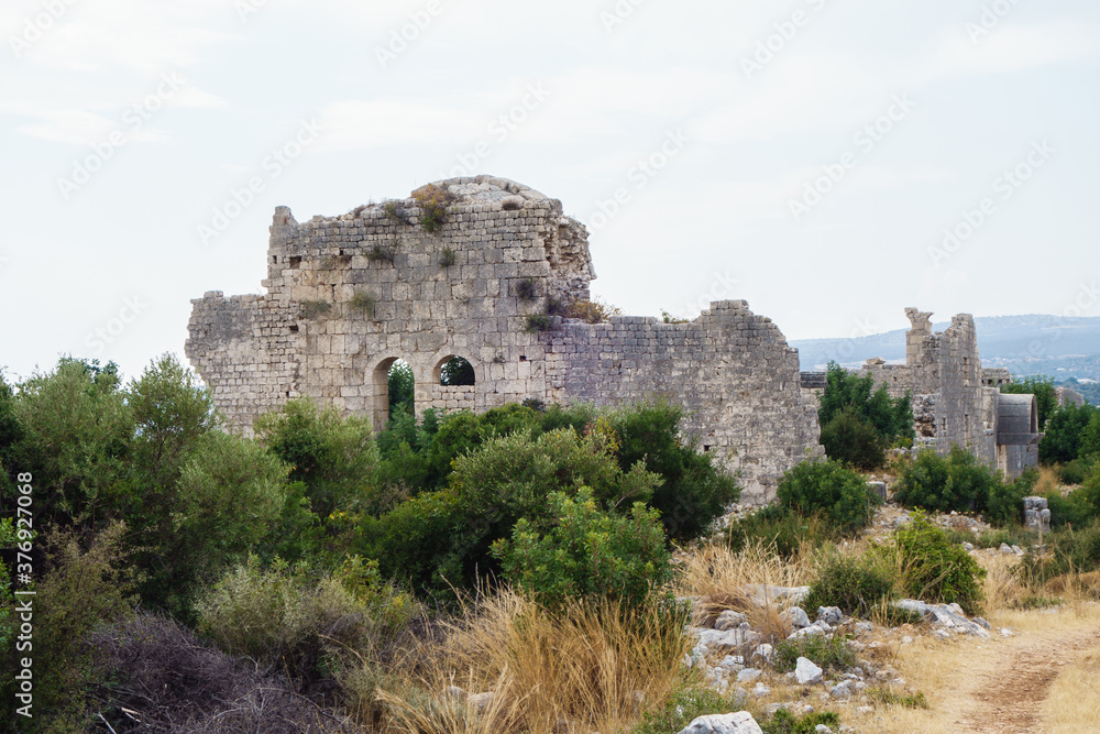 Ruins of church in ancient city Korikos, Kızkalesi, Turkey. City was important port of Kingdom of Cilicia, abandoned after series of wars in medieval.