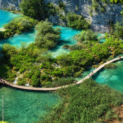 Fototapeta Naklejka Na Ścianę i Meble -  Plitvice lakes in Croatia. National Park in summer. Waterfalls and lakes among the forest. Footpath for hiking. Croatian travel image.