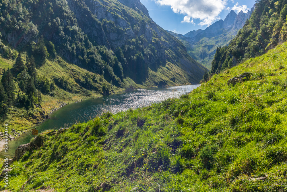 The majestic Alpstein mountain range surrounding the Faelensee lake in the Swiss canton of Appenzell