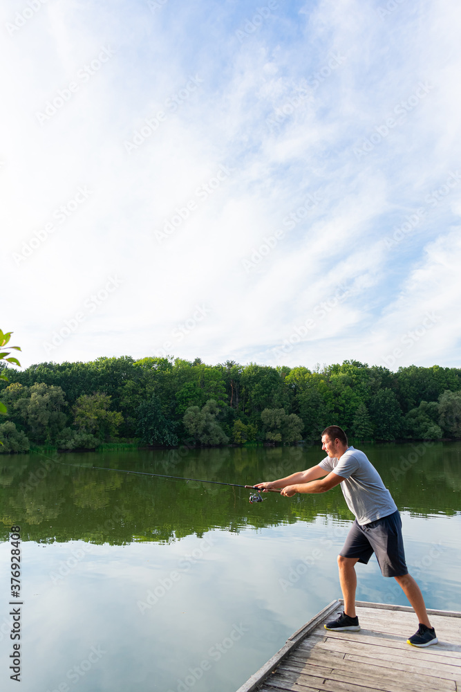 Young man fishing in the river