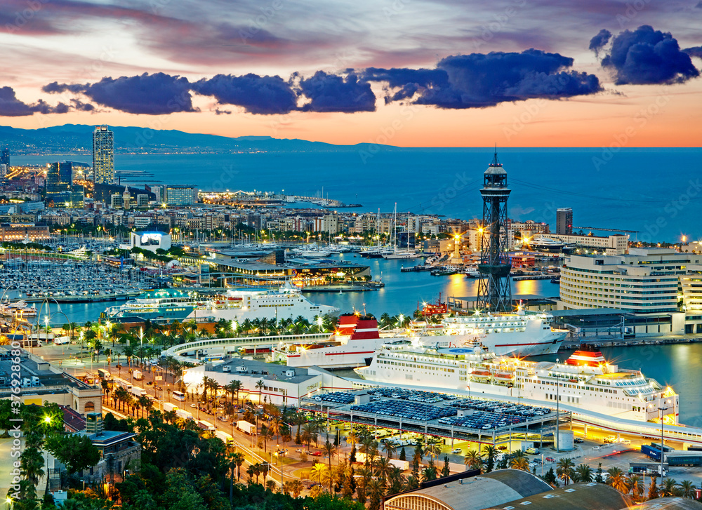 Aerial view of the port of Barcelona illuminated at sunrise