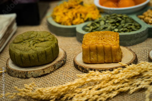 Photography Mid-Autumn Festival moon cake, colorful food and drink on burlap background
