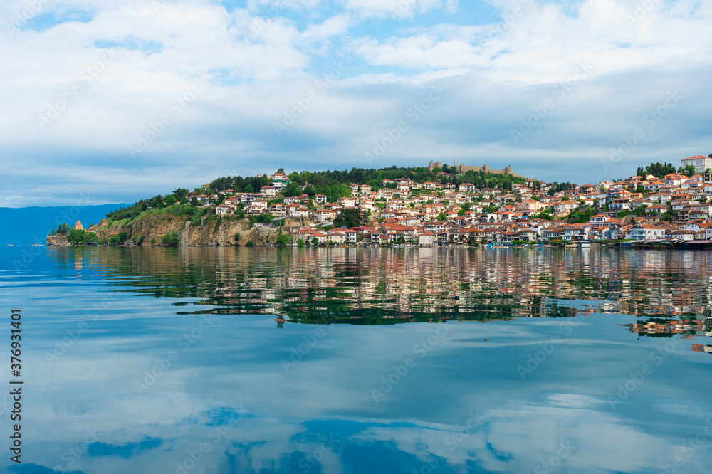 Ohrid and Church of St John Theologian-Kaneo reflecting in Ohrid lake, Macedonia