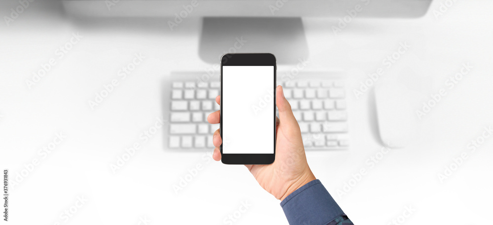 Fototapeta premium Hand holding smartphone device touching screen