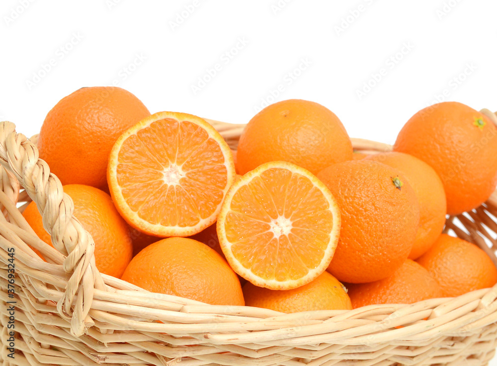 Orange mandarin or tangerine fruit isolated in basket on white background Orange mandarin or tangerine fruit isolated in basket on white background