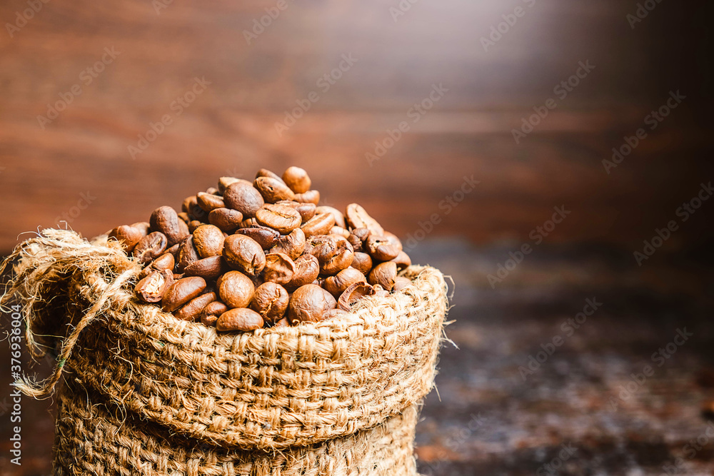 Fototapeta premium .Roasted coffee beans in brown sacks