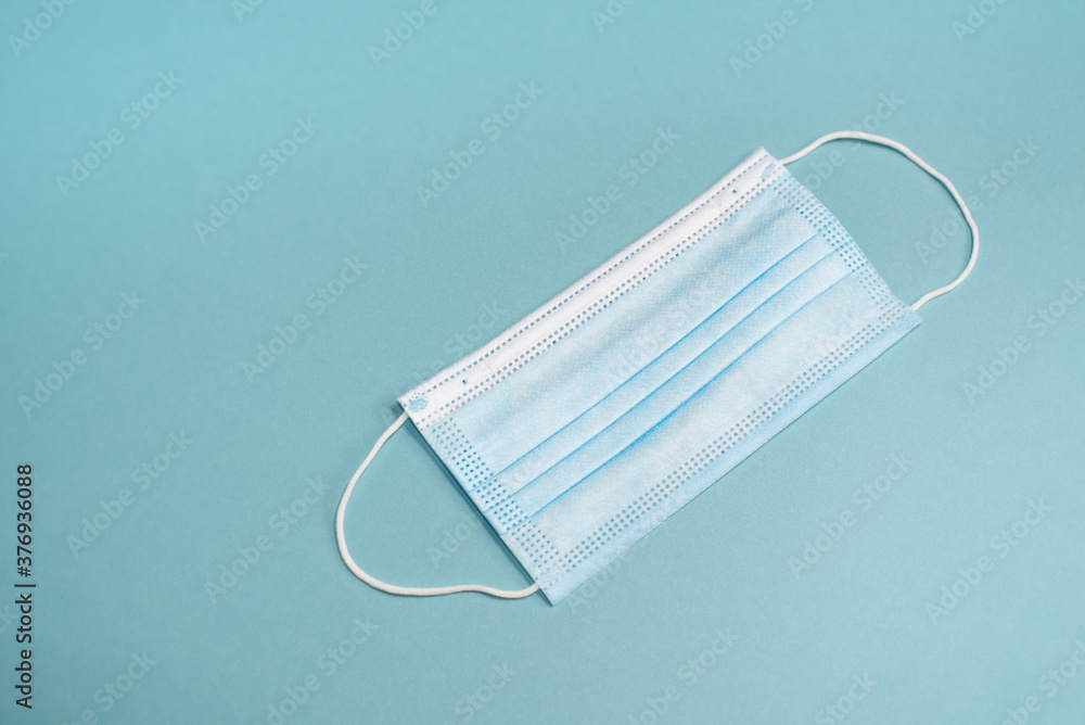 Protective mask from Covid 19 on a blue background Protective mask from Covid 19 on a blue background